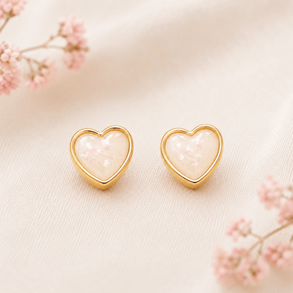 Heart-shaped earrings with a floral design on a light background