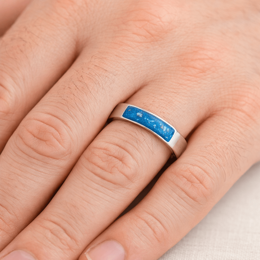 Model wearing the Legacy inlay unisex ring made from solid silver with a blue keepsake stone made from cremation ashes.